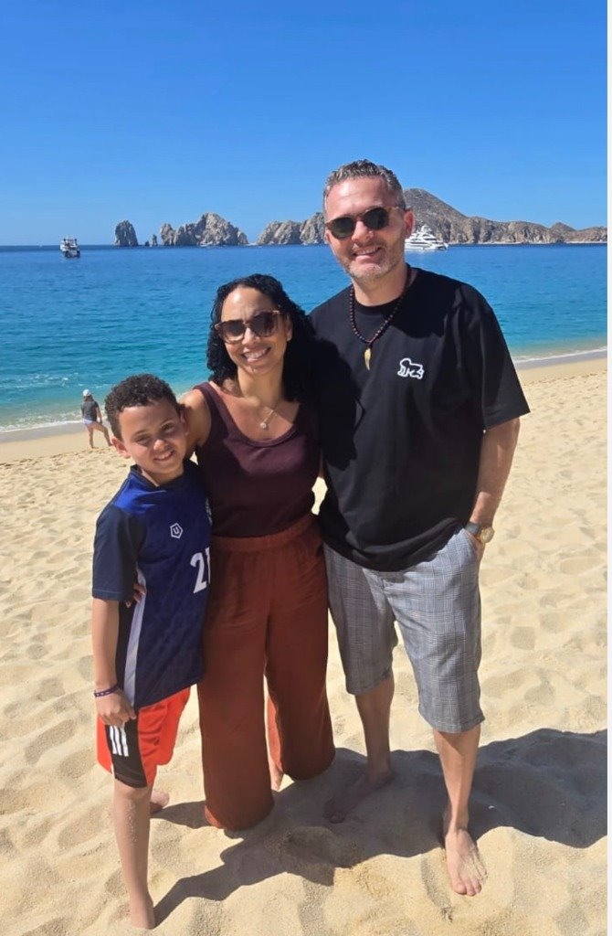 Oliver Ziman with his wife and son on the beach